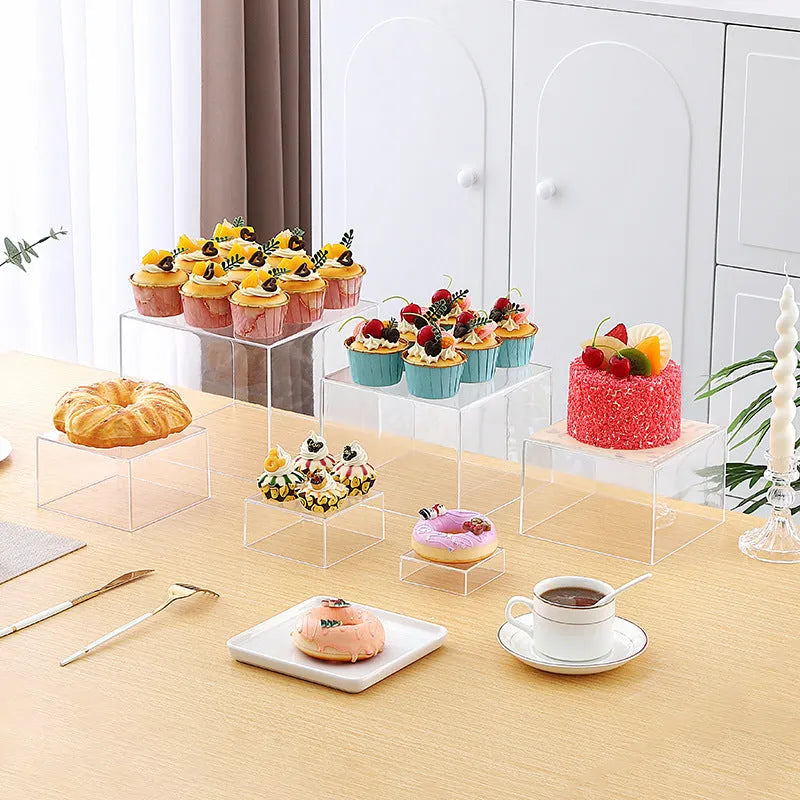 White plastic six-piece stacking dessert table display stand set for tiered bakery presentation