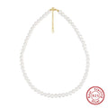 Women's adjustable silver necklace with natural freshwater pearls on a model.