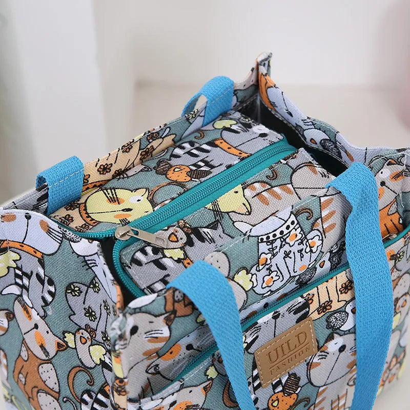 Women's printed canvas tote bag with aluminium frame showing horizontal square shape and floral pattern design