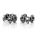 Stainless steel skull earrings with geometric hollow design and clip fitting in metallic finish