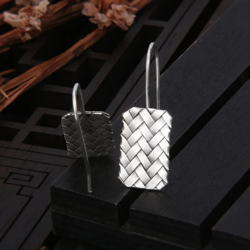 Geometric woven diamond plaid earrings in silver measuring 17.5mm by 11mm
