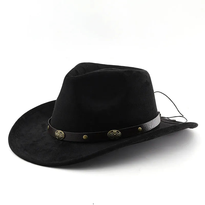 Brown leather velvet curved edge Western cowboy hat with a conical crown on a table.
