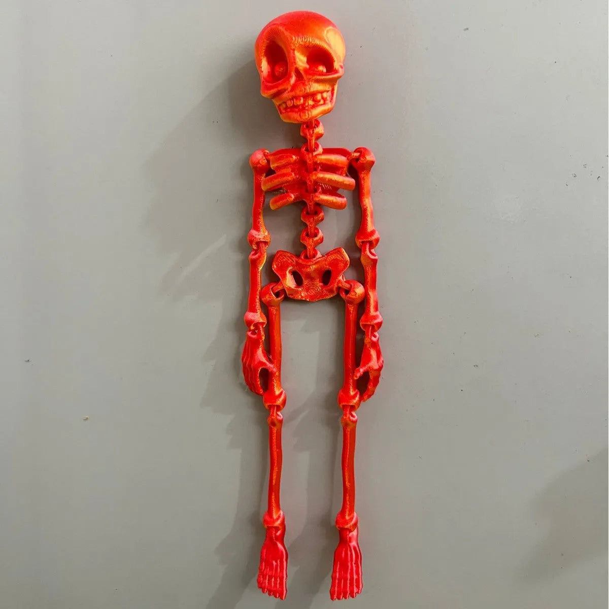3D printed PLA skull ornament refrigerator magnet in assorted colours, 18cm high.