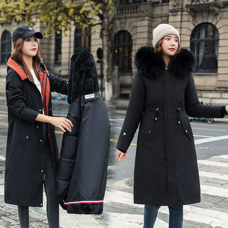 Women's long beige trench coat with a two-way zip, shown on a model.