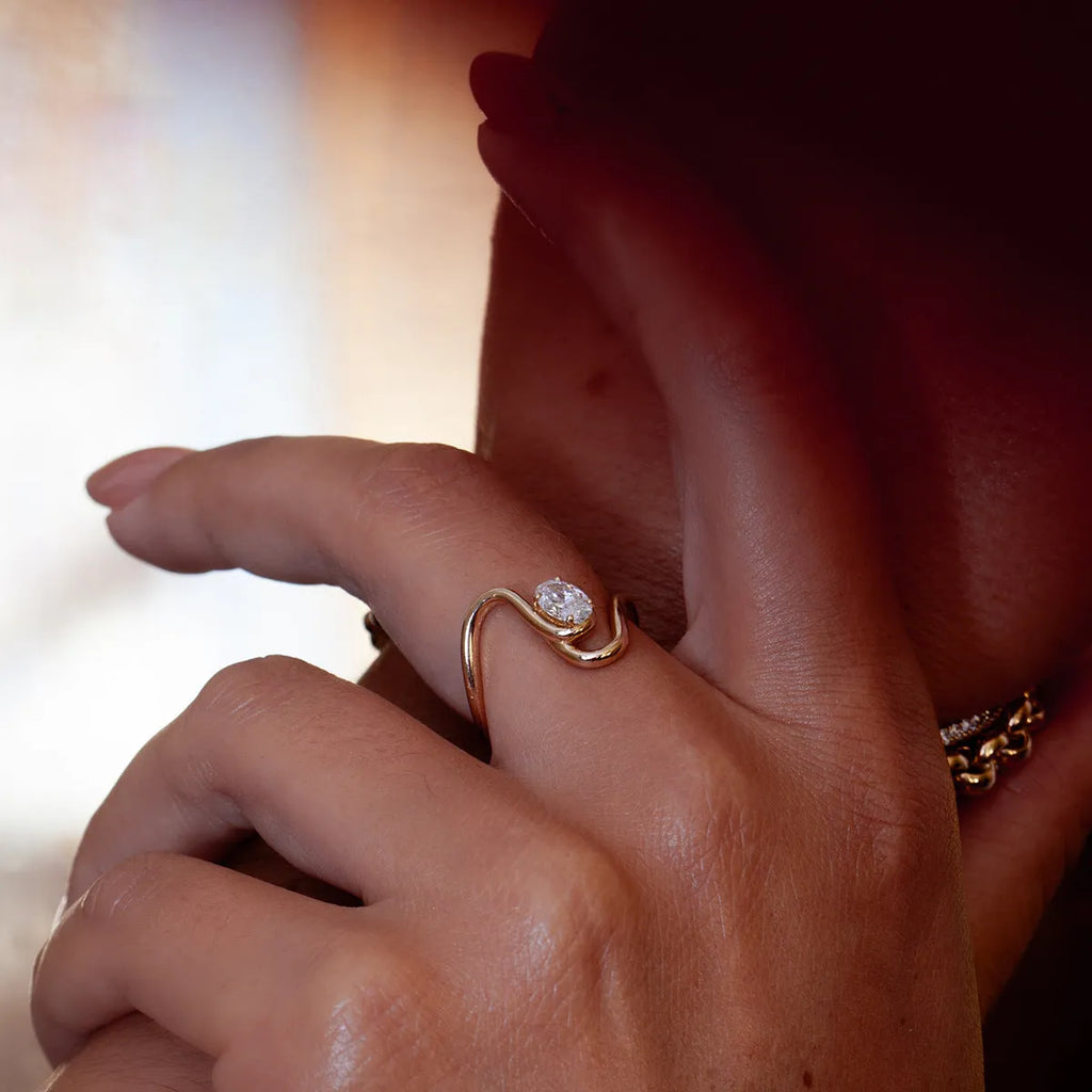 Geometric stainless steel zircon ring in European style on a grey background.