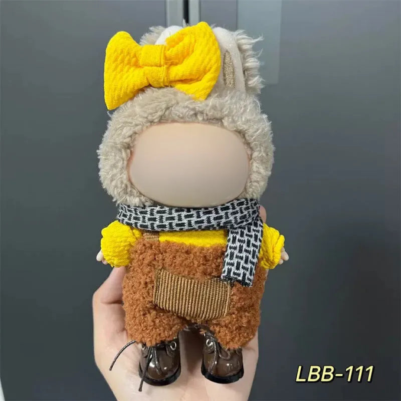 Plastic doll clothing costume for 17cm tall vinyl figurines on a display stand.