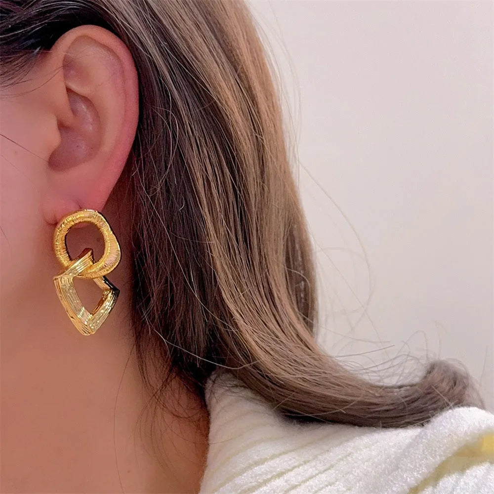 Geometric copper pendant earrings with 3.4cm drop and electroplated gold or silver finish