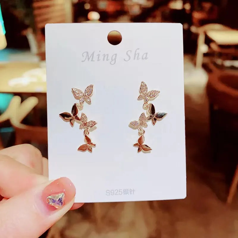 Women's copper butterfly earrings with four motifs and gold-plated drops