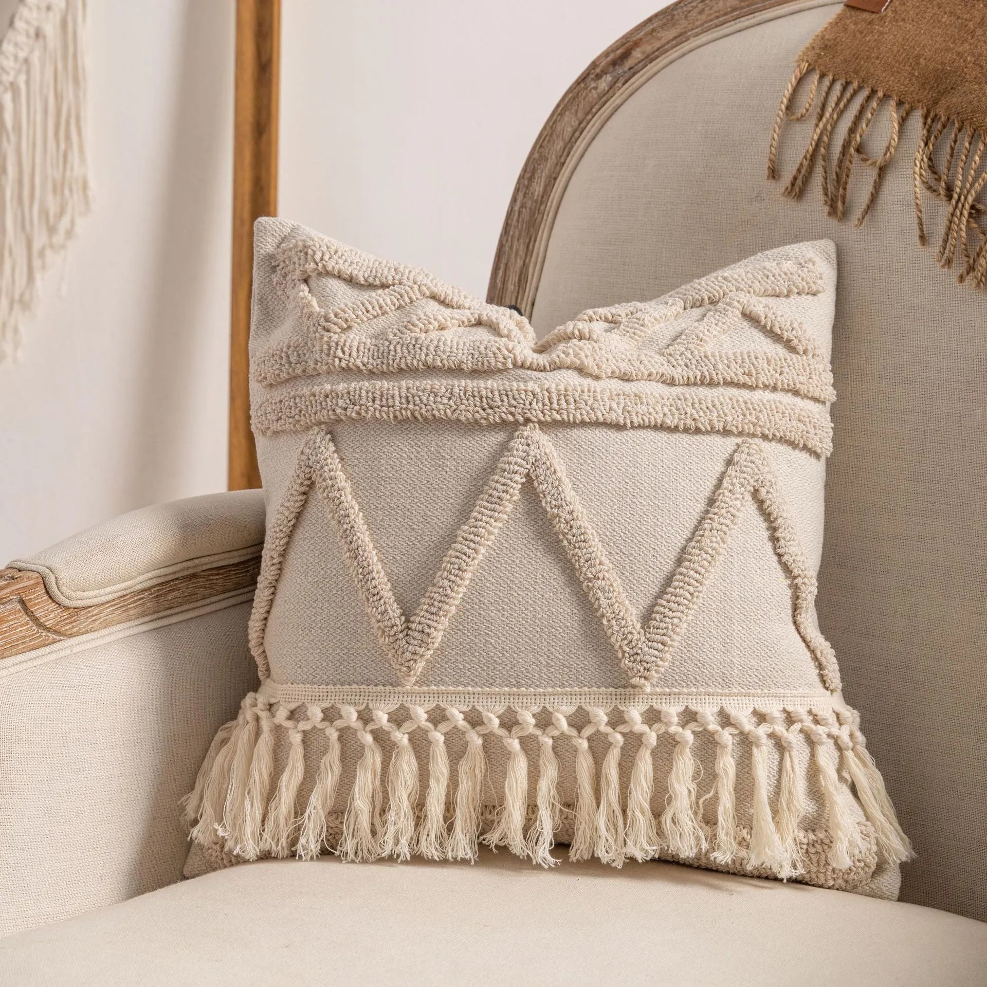 Knitted sofa cushion cover with tassel detail and striped pattern in spiral dots colour design