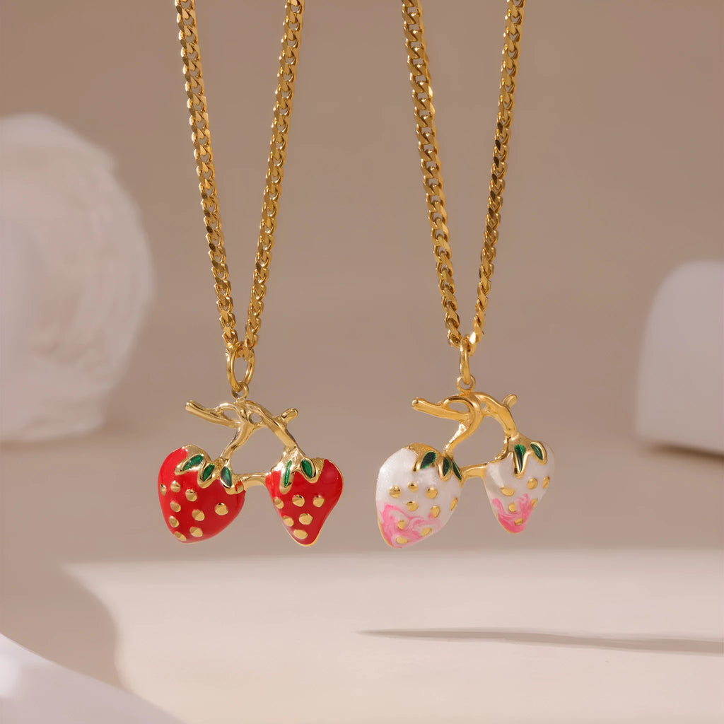 Stainless steel strawberry fruit pendant necklace on an alloy chain, shown in red and white colour options.