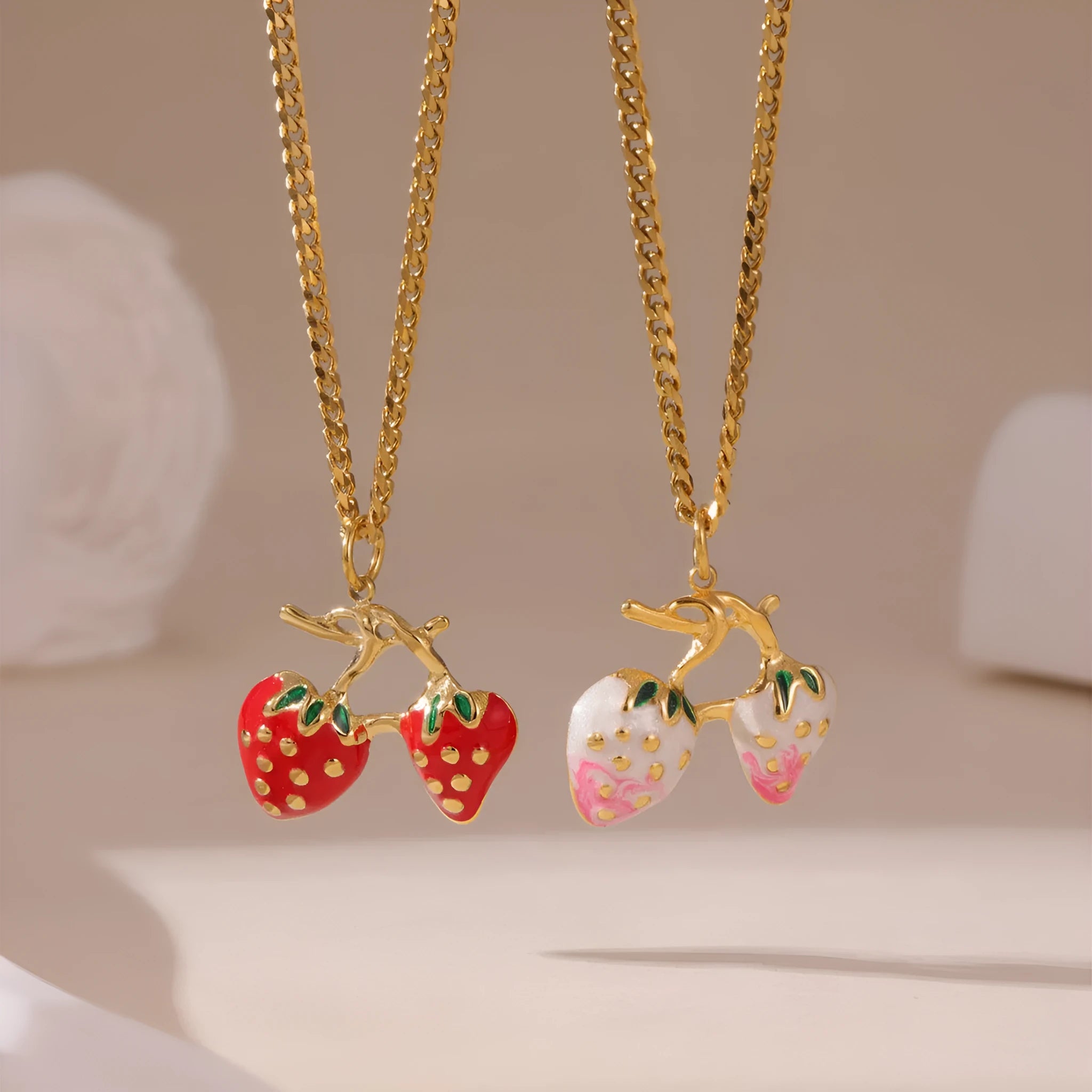 Stainless steel strawberry fruit pendant necklace on an alloy chain, shown in red and white colour options.