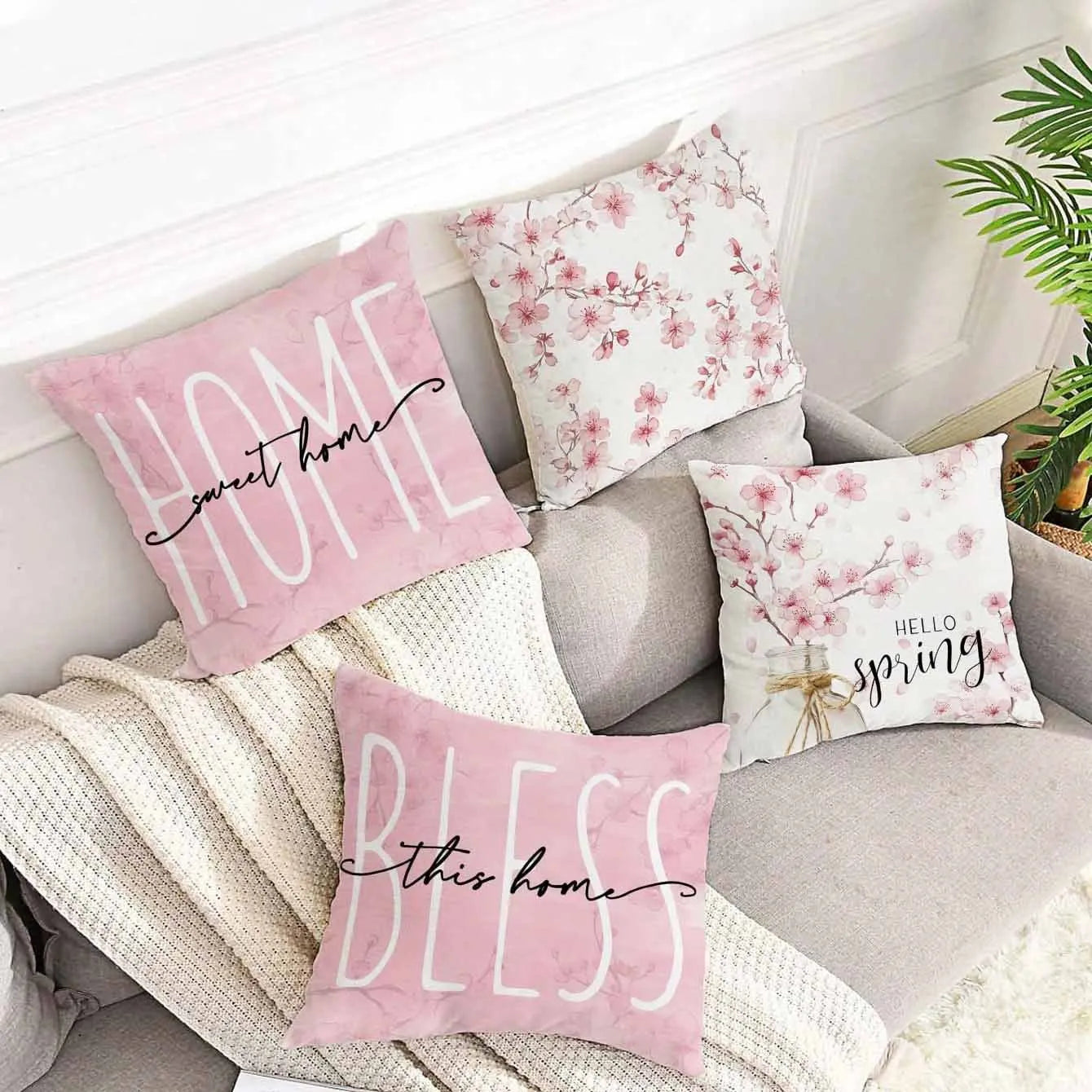 Short velvet cushion cover with cherry blossom letter print, 45cm square, shown in one of four colours.