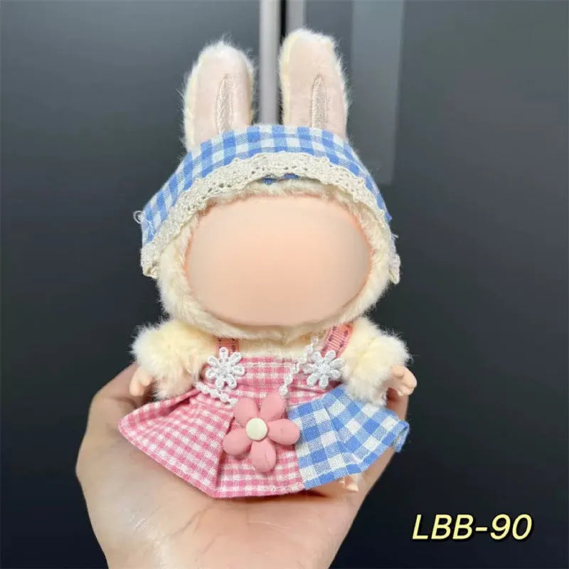 Plastic doll clothing costume for 17cm tall vinyl figurines on a display stand.