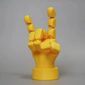 Yellow American-style hand ornament with movable joints made from PLA plastic.