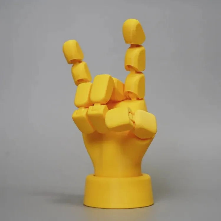 Yellow American-style hand ornament with movable joints made from PLA plastic.