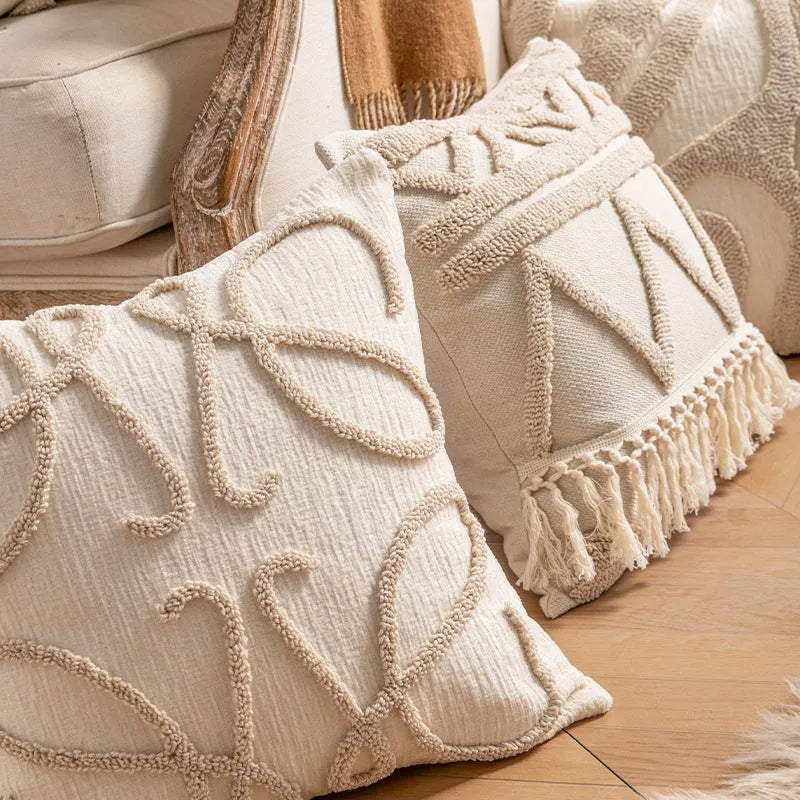 Knitted sofa cushion cover with tassel detail and striped pattern in spiral dots colour design