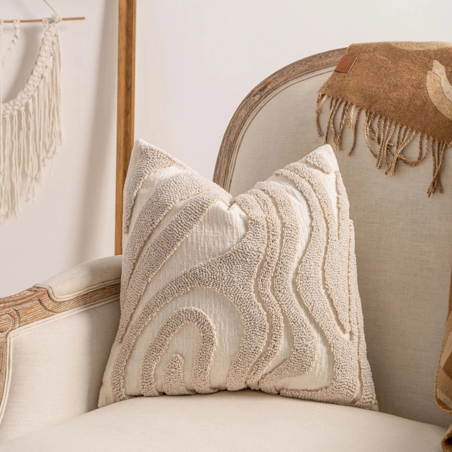 Knitted sofa cushion cover with tassel detail and striped pattern in spiral dots colour design