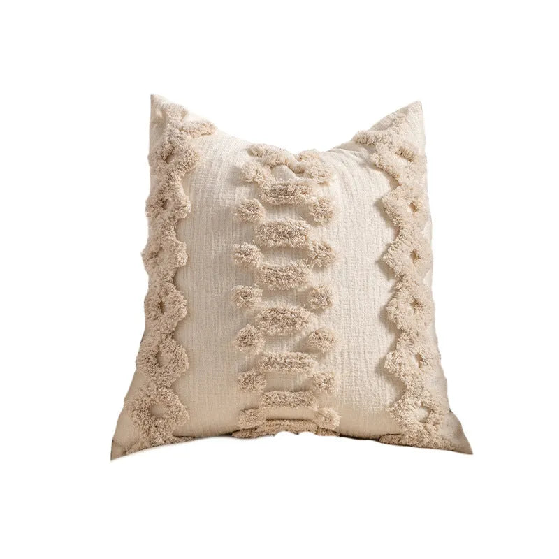 Knitted sofa cushion cover with tassel detail and striped pattern in spiral dots colour design