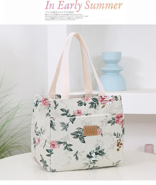 Women's printed canvas tote bag with aluminium frame showing horizontal square shape and floral pattern design