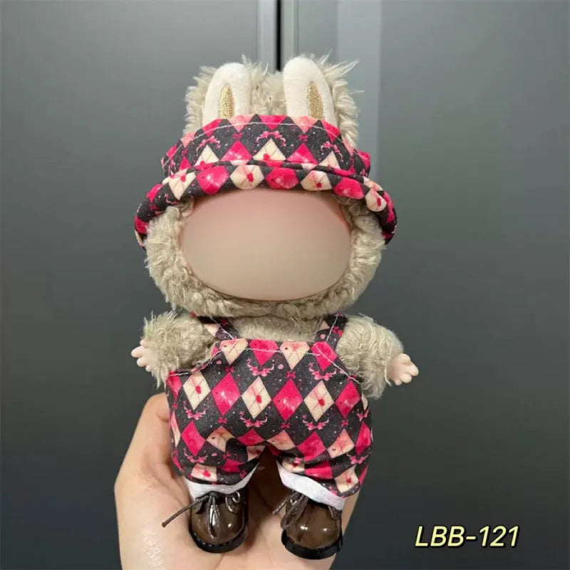 Plastic doll clothing costume for 17cm tall vinyl figurines on a display stand.