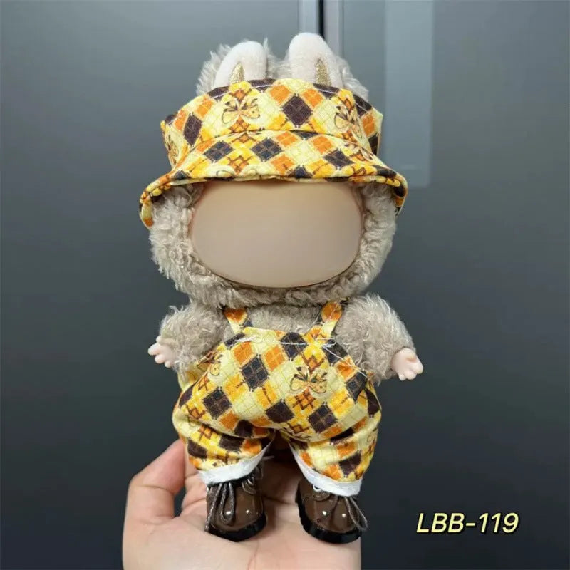 Plastic doll clothing costume for 17cm tall vinyl figurines on a display stand.
