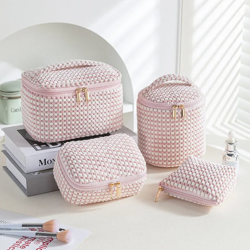 Four-piece flannelette makeup bag set in cube style design with polyester material