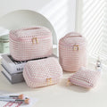 Four-piece flannelette makeup bag set in cube style design with polyester material