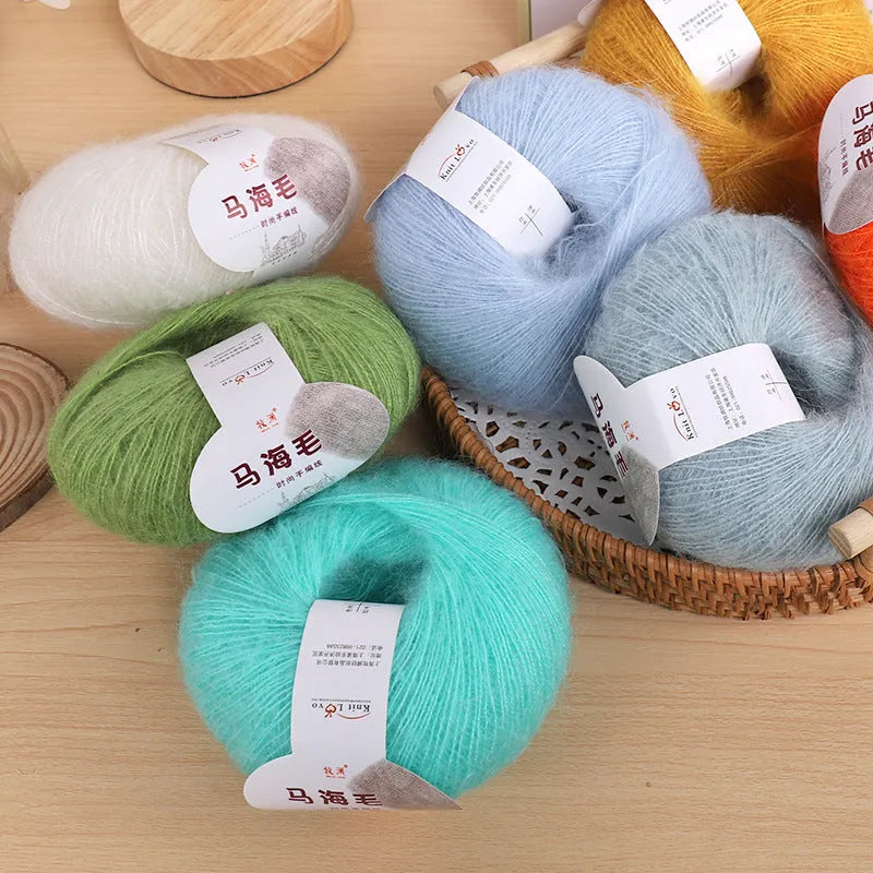 Mohair wool ball for DIY scarf knitting in assorted colours on white background