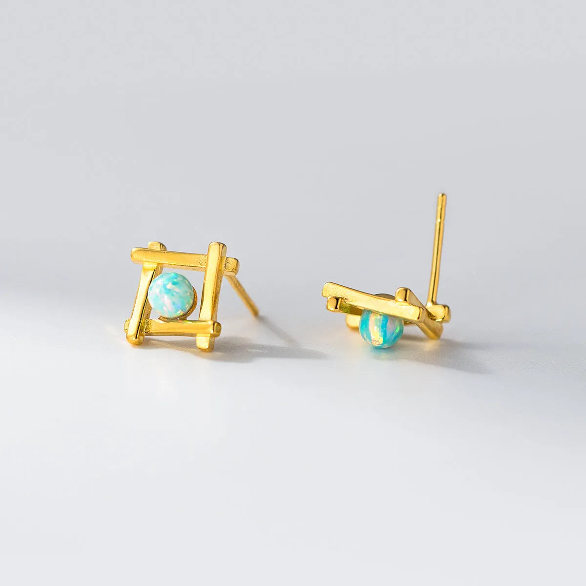 Geometric cross quadrangle stud earrings in 925 sterling silver with Seiko treatment