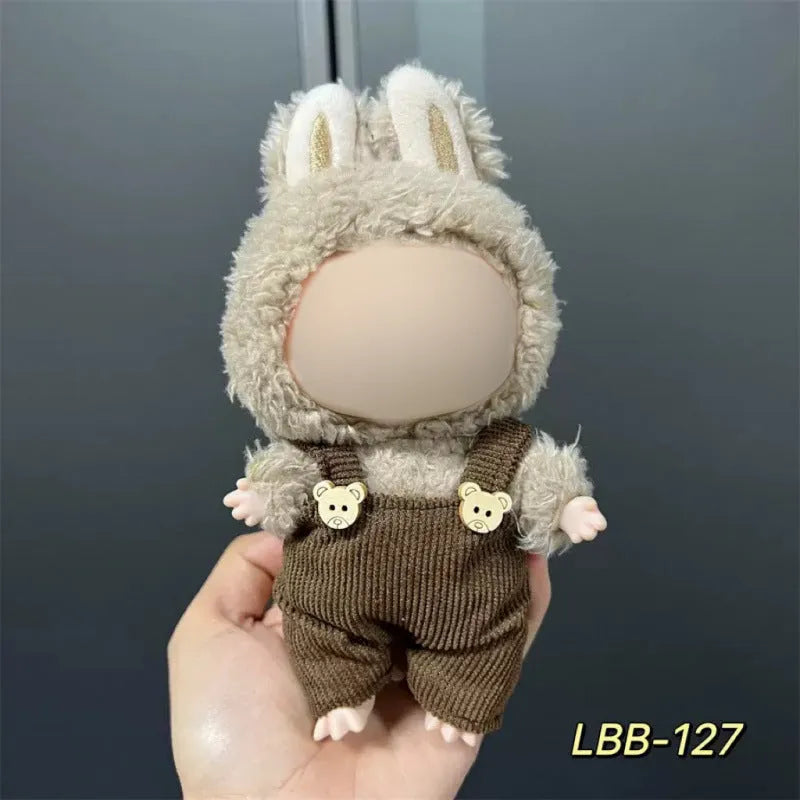 Plastic doll clothing costume for 17cm tall vinyl figurines on a display stand.