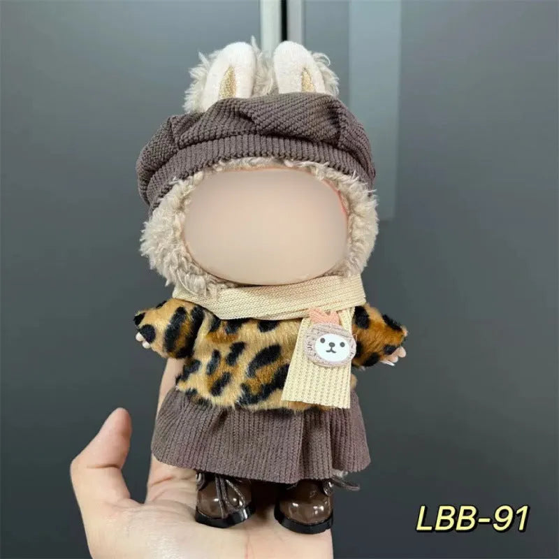 Plastic doll clothing costume for 17cm tall vinyl figurines on a display stand.