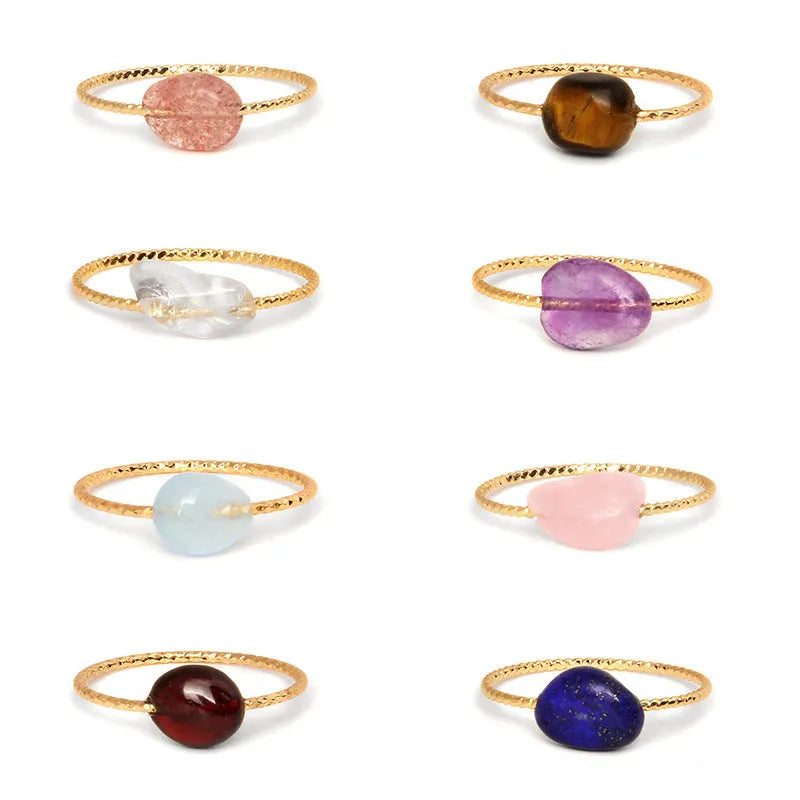 Original geometric women's agate ring on a hand, showing unique stone banding in one of eight colour options.