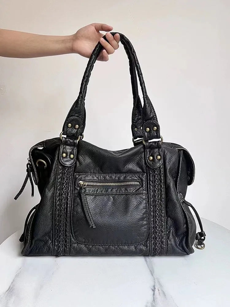 Women's retro shoulder messenger bag in soft PU leather with internal compartments and weaving detail