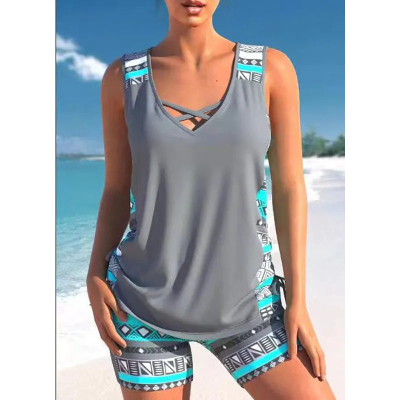 Women's blue printed lace two-piece swimsuit top and shorts laid flat.