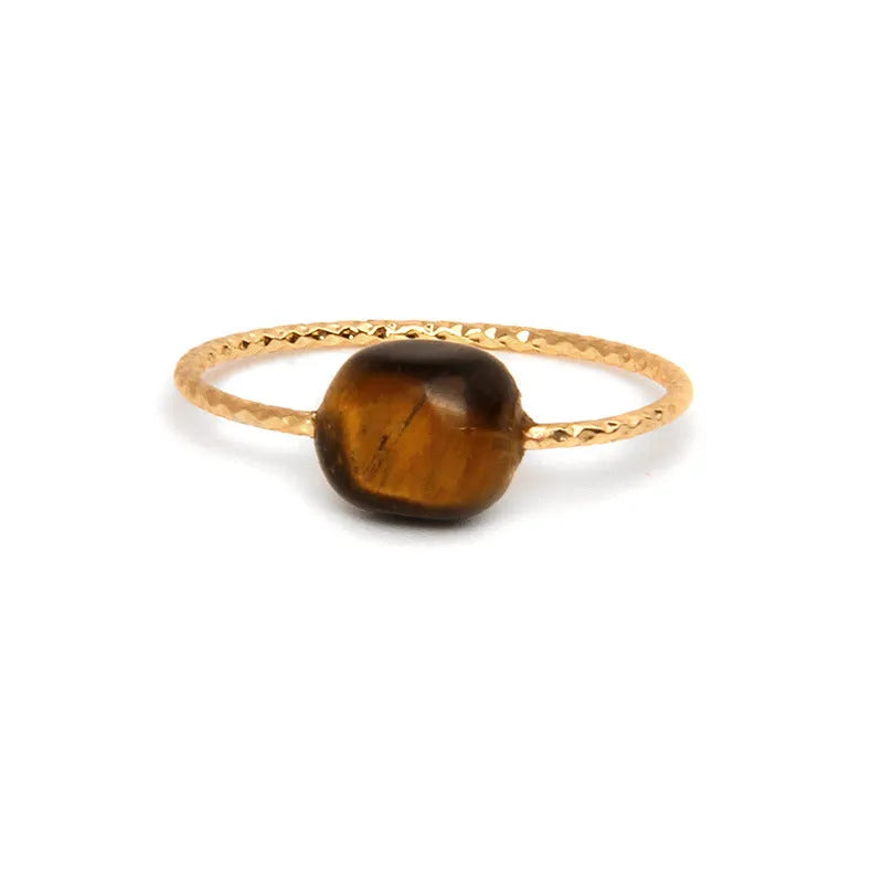 Original geometric women's agate ring on a hand, showing unique stone banding in one of eight colour options.