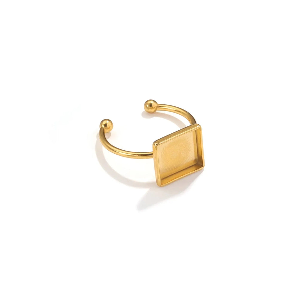 Assortment of golden electroplated stainless steel ring settings and DIY jewellery components in various shapes.