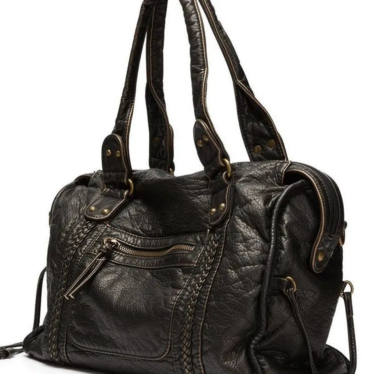 Women's retro shoulder messenger bag in soft PU leather with internal compartments and weaving detail