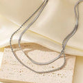 Stainless steel double-layer twist necklace with snake bones chain and geometric titanium steel pendant