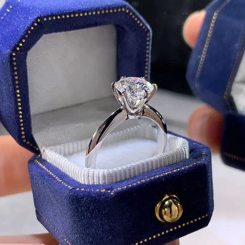 White gold plated copper ring with six-claw set zircon stone, geometric shape.