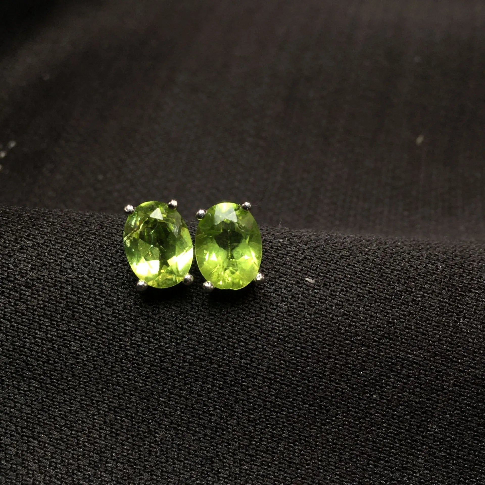 Natural olivine faceted stud earrings in S925 sterling silver with 6 × 8mm grass green oval stone