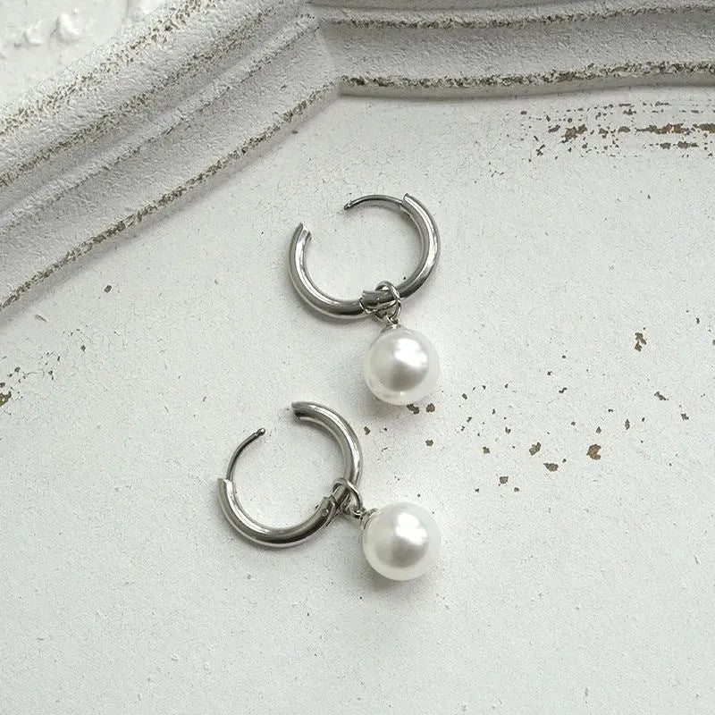 Pearl drop earrings with geometric alloy shape and titanium steel posts