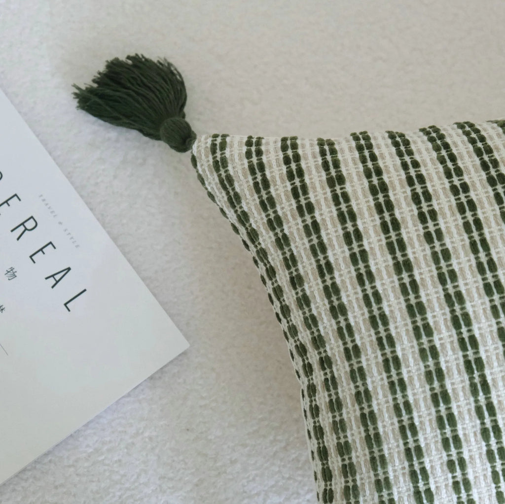 Green botanical patterned decorative pillows in striped, tree, and leaf designs on brushed cotton linen fabric