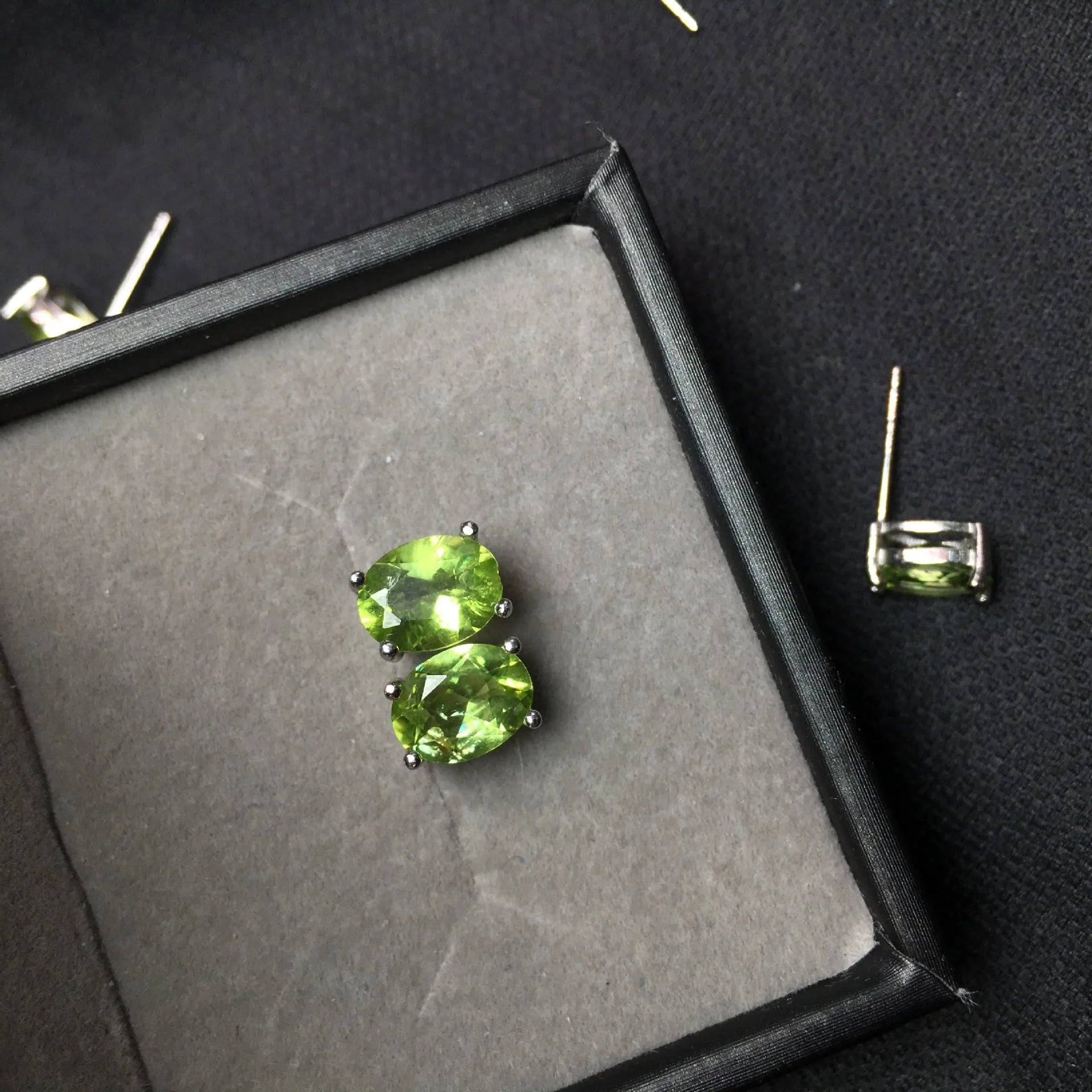 Natural olivine faceted stud earrings in S925 sterling silver with 6 × 8mm grass green oval stone