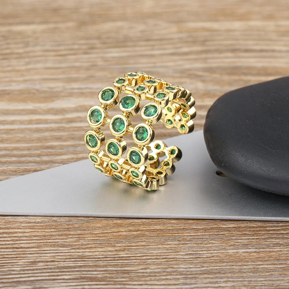 Copper ring with 18K gold three-layer plating and green zircon detailing on wide band