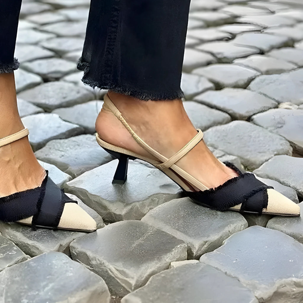 Apricot black women's pointed toe stiletto heel sandals with a buckle strap fastening.