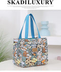 Women's printed canvas tote bag with aluminium frame showing horizontal square shape and floral pattern design