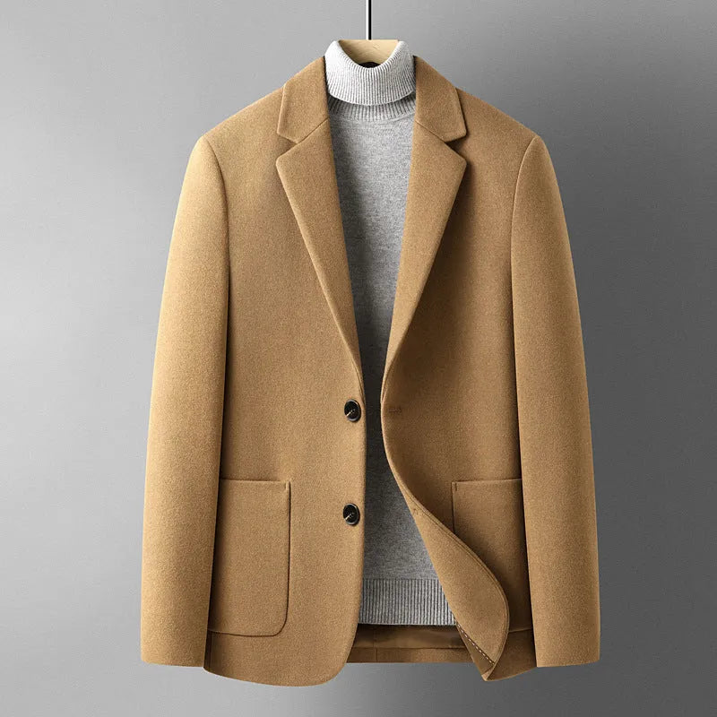 Men's slim-fit wool suit jacket in grey, shown on a hanger.