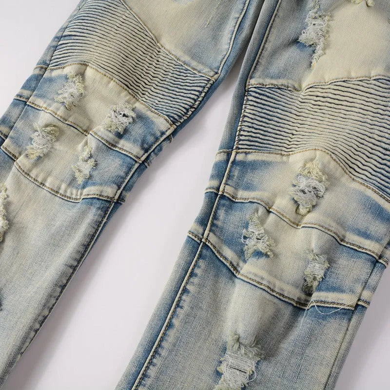 Light blue men's slim fit jeans with hand-frayed distressed details and a straight leg opening.