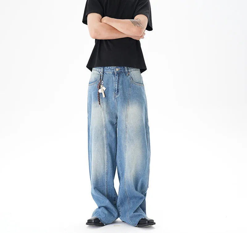 Light blue vintage wash wide leg denim jeans on a model, showing the relaxed fit and zip fly.