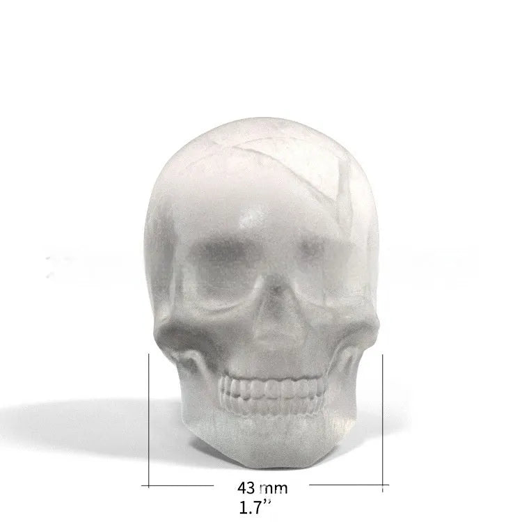Halloween ice cube tray creating 3D skull-shaped ice moulds from food-grade silicone